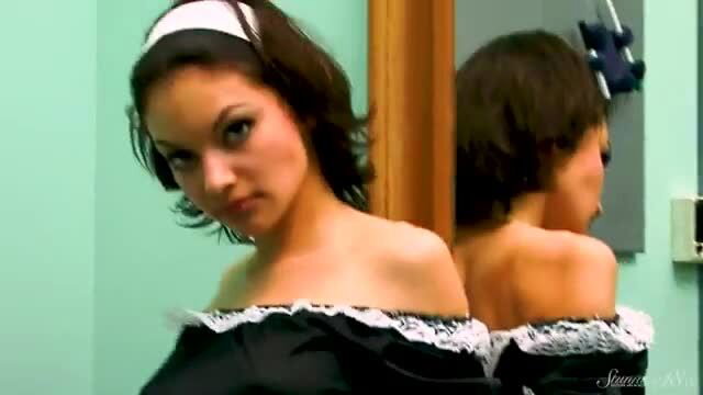 Charming maid Julia undresses, sexy shoulder view in mirror