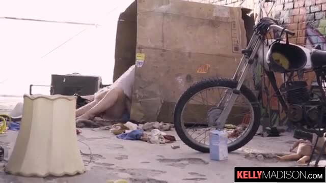 Samantha Rone legs spread by cardboard box near motorcycle