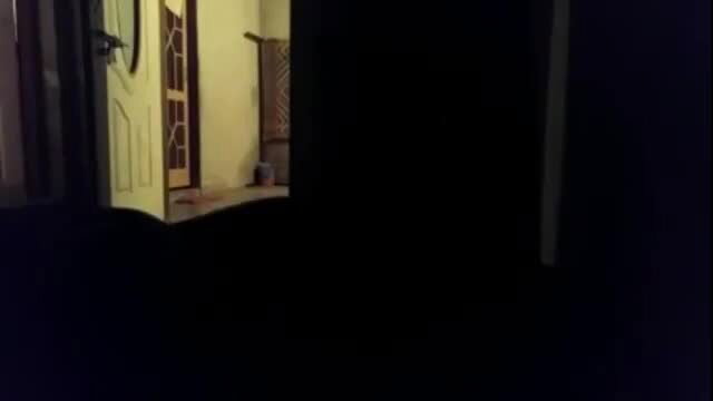 Hot Indian babe in yellow saree by open door, teasing pose