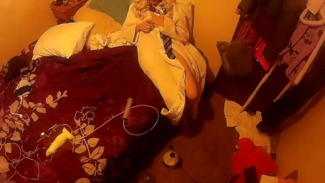 Annabelle Bestia in Harry Potter robe on bed, legs spread solo tease