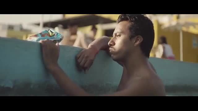 Nude man holding sneaker by pool, Paulina Gaitan naked scene