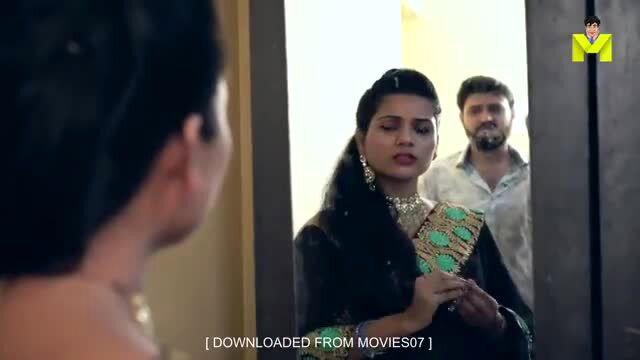 Indian couple in mirror reflection, desi beauty in green saree with husband