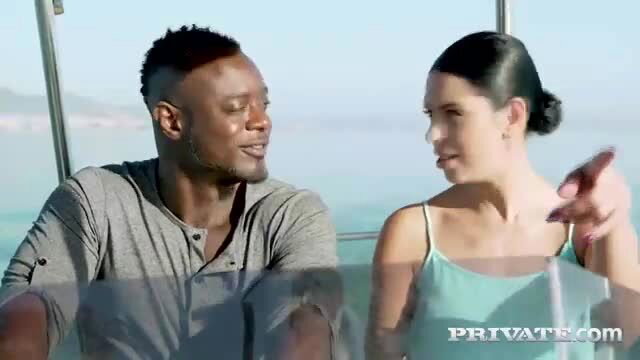 Kira Queen chats intimately with black stud on boat outdoors