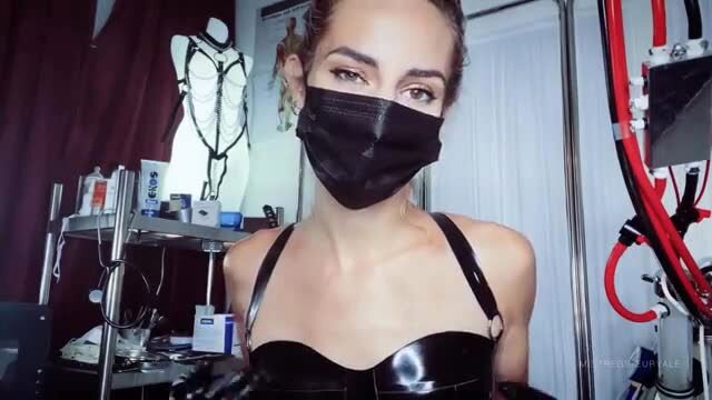 Mistress Euryale in latex harness and mask, fetish tease