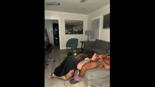 Hot American PAWG in black dress kneels to suck thick cock on couch