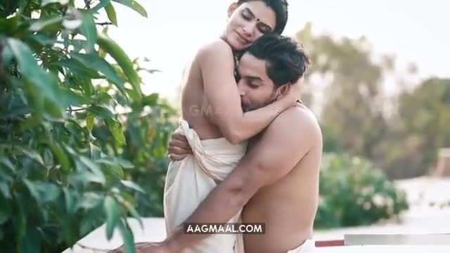 Indian busty MILF nude embraced by hunk in outdoor hug
