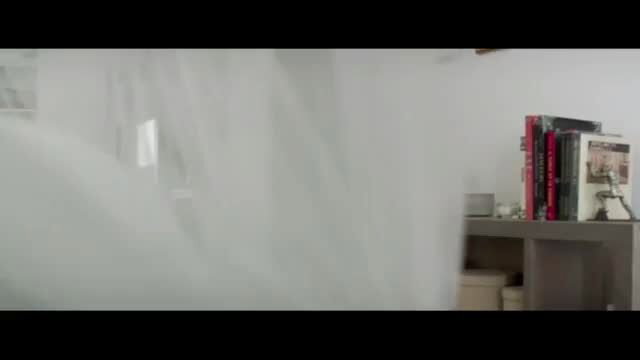 Yvonne Strahovski in steamy shower behind white curtain