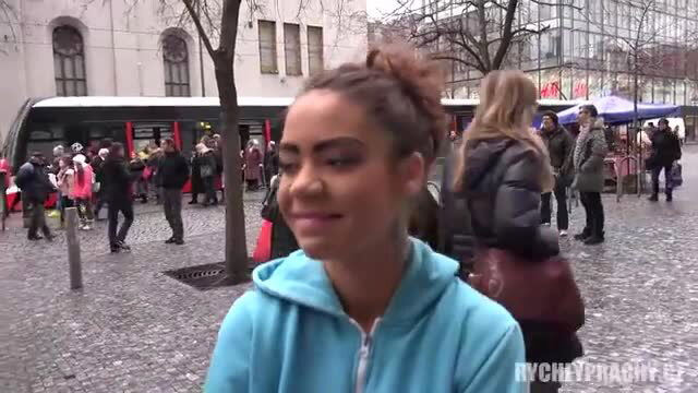 Mixed-race gypsy teen in hoodie smiles at street cash pickup