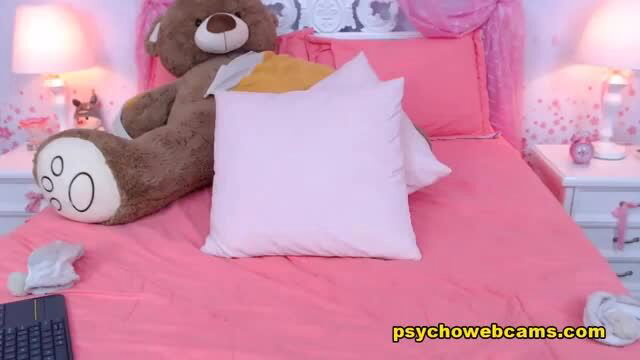 Cute girl in bra on pink bed with teddy bear solo tease