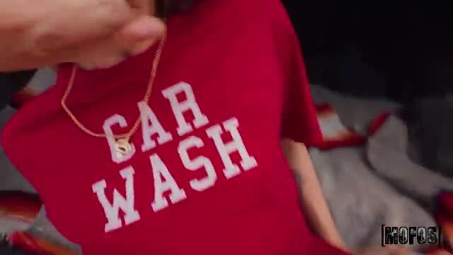Shrooms Q in red Car Wash t-shirt, gold chain, hands groping her chest