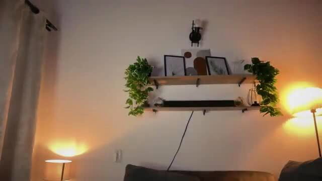 Tattooed Latina with big tits topless smiling seductively