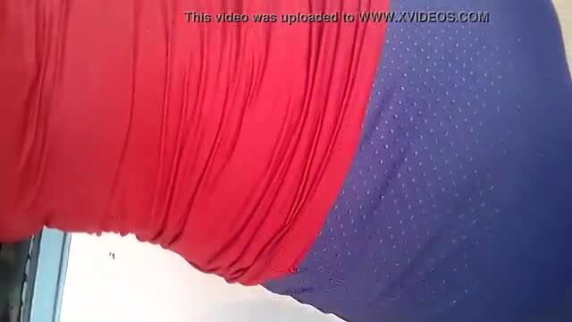 Teen hottie bends over in tight red top and blue leggings