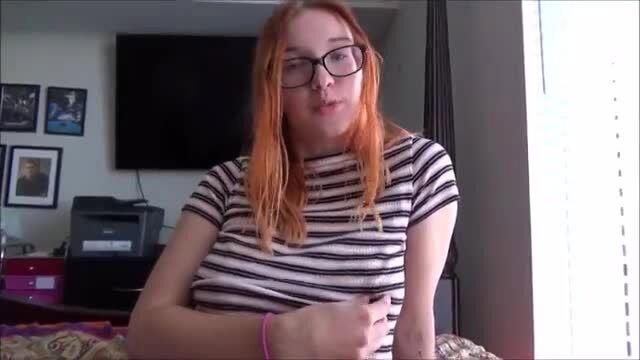 Redhead teacher in striped top with big tits smiles at camera