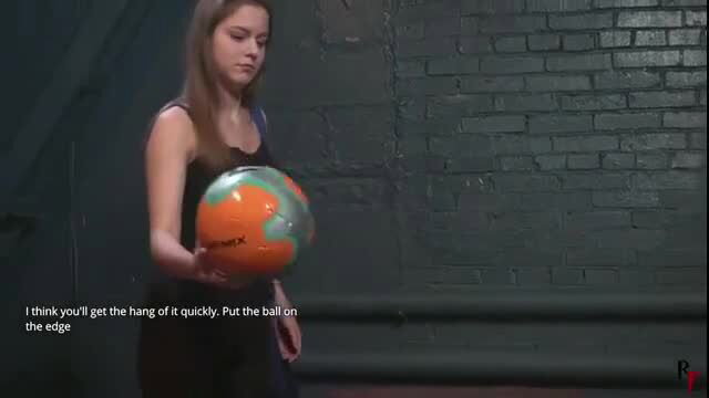 Leya Falcon holds soccer ball in tight tank top interview
