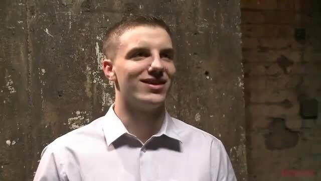 Handsome young white man smiling in white shirt, kinky dom vibe