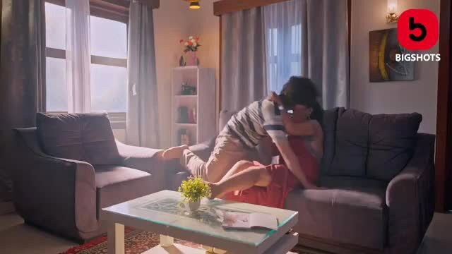 Sex-addicted Indian MILF passionately kissing man on couch