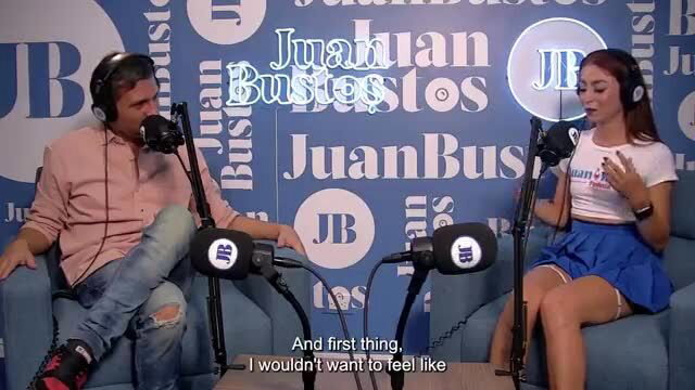 Petite Latina girl on podcast in mini skirt, hot legs out