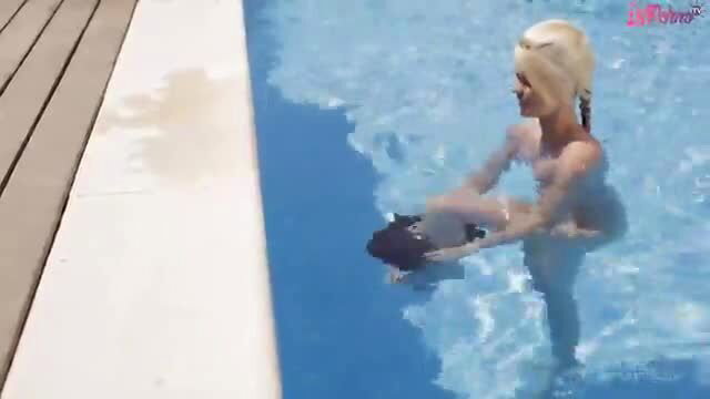 Blonde teen in wet see-thru swimsuit eats pussy poolside