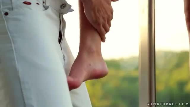 Anita Bellini foot fetish tease in white jeans, bare foot on bulge