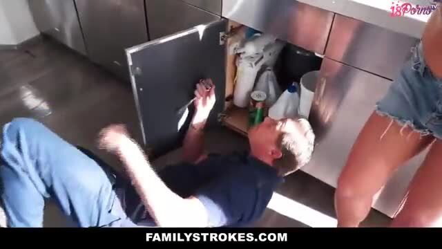 Hot girl in pink panties seduces older plumber under kitchen sink
