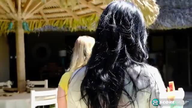 Codi Vore in wet see-thru top at beach bar with blonde