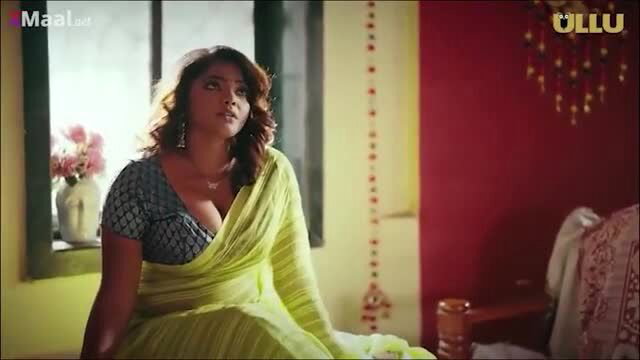 Indian busty beauty in deep green saree with plunging neckline