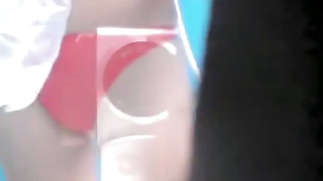 Spy cam of busty woman in red thong bending over in changing room