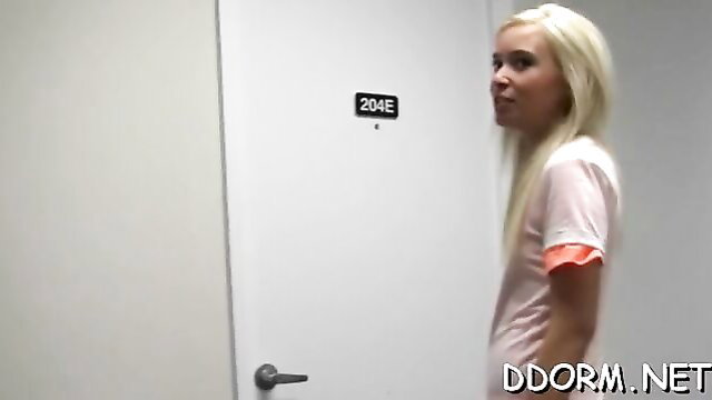 Blonde teen in pink shirt outside dorm room door, racy blowbang preview