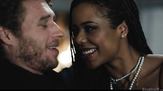 Kira Noir smiles intimately with handsome man in erotic closeup