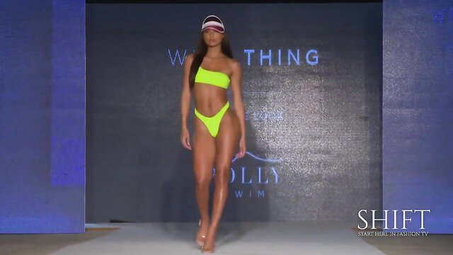 Hot black model walks Miami Swim Week in neon yellow bikini