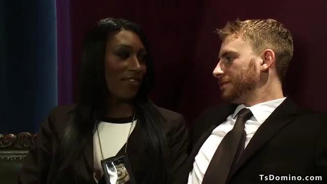 Black shemale cop chats intimately with white male partner indoors