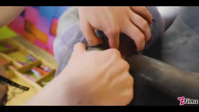 Anuskatzz and Miss Flora hands gripping strapon in threesome tease