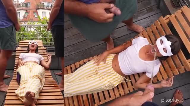 Asian masked girl lying topless, penis on belly, watersports tease