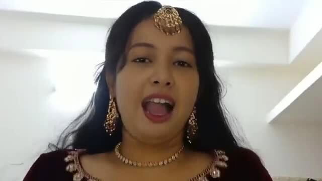 Newlywed Desi bride in maroon lehenga screams with mouth open on first night