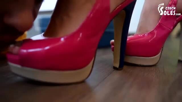 Ebony goddess in red platform heels worshipped by plumber at her feet