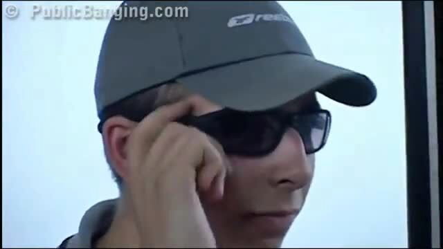 Arab teen pretty in shades and cap adjusting glasses on public bus