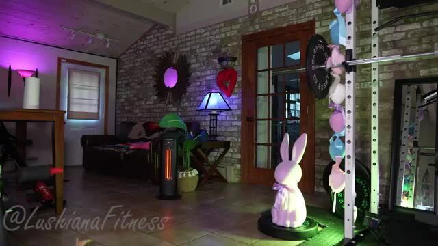 Lushianafitness in pink bunny outfit in gym room tour