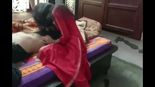 Diya in red salwar kameez groping Desi man's bare abs on bed