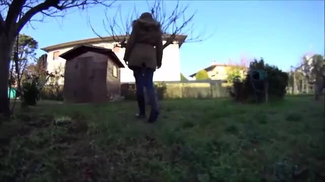 Gabriella walks in garden wearing muddy flat boots to lick clean