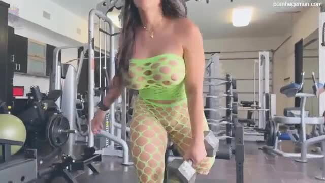 Yinyleon in sheer green fishnet lingerie lifting weights at gym