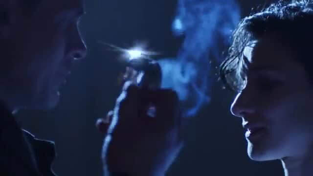 Vicki Michelle lit cigarette by man in smoky intimate scene