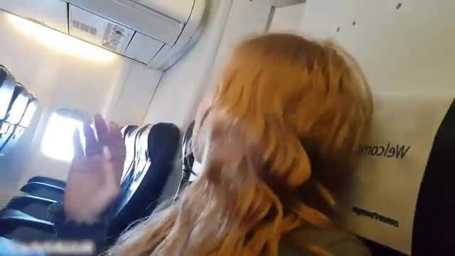 Redhead Russian girl waving on airplane, amateur public tease