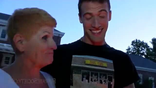 Honeyy Brooks smiles with young man in Zabar's tee outdoors