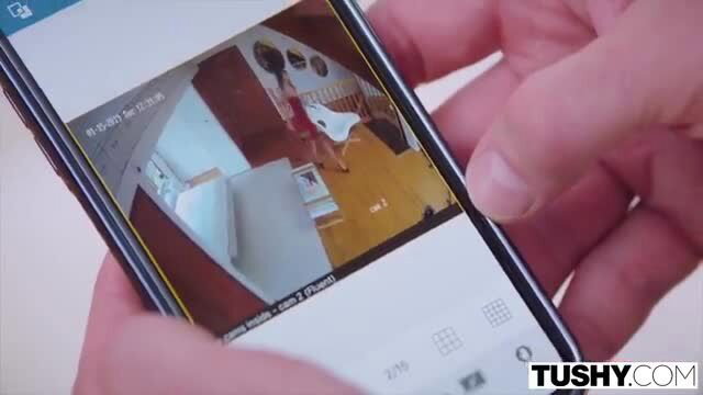 Busty brunette in red dress watches nanny cam on phone, Tushy Raw