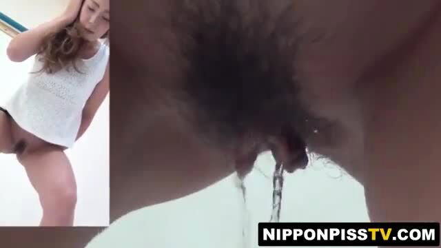 Japanese babe hairy pussy peed on by black cock closeup