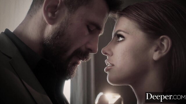 Adriana Chechik close-up with bearded man, intense gaze, Deeper