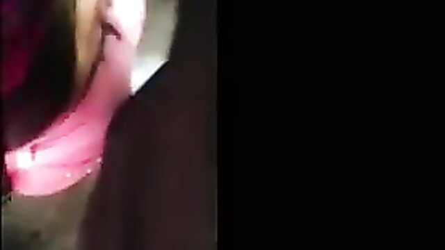 Latina woman in pink lingerie pressed against glass, big tits tease