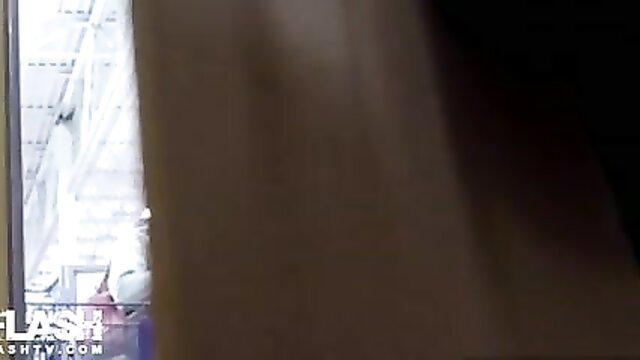 Busty blonde caught bending over in tight skirt, upskirt view