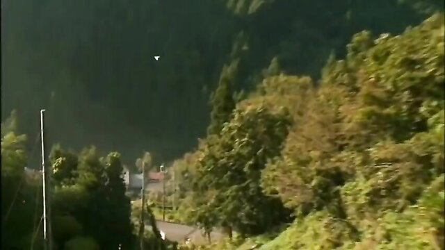 Naughty flasher in lush green forest mountains outdoors