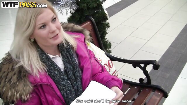 Blonde MILF in pink fur coat waiting on bench in mall, public toilet tease